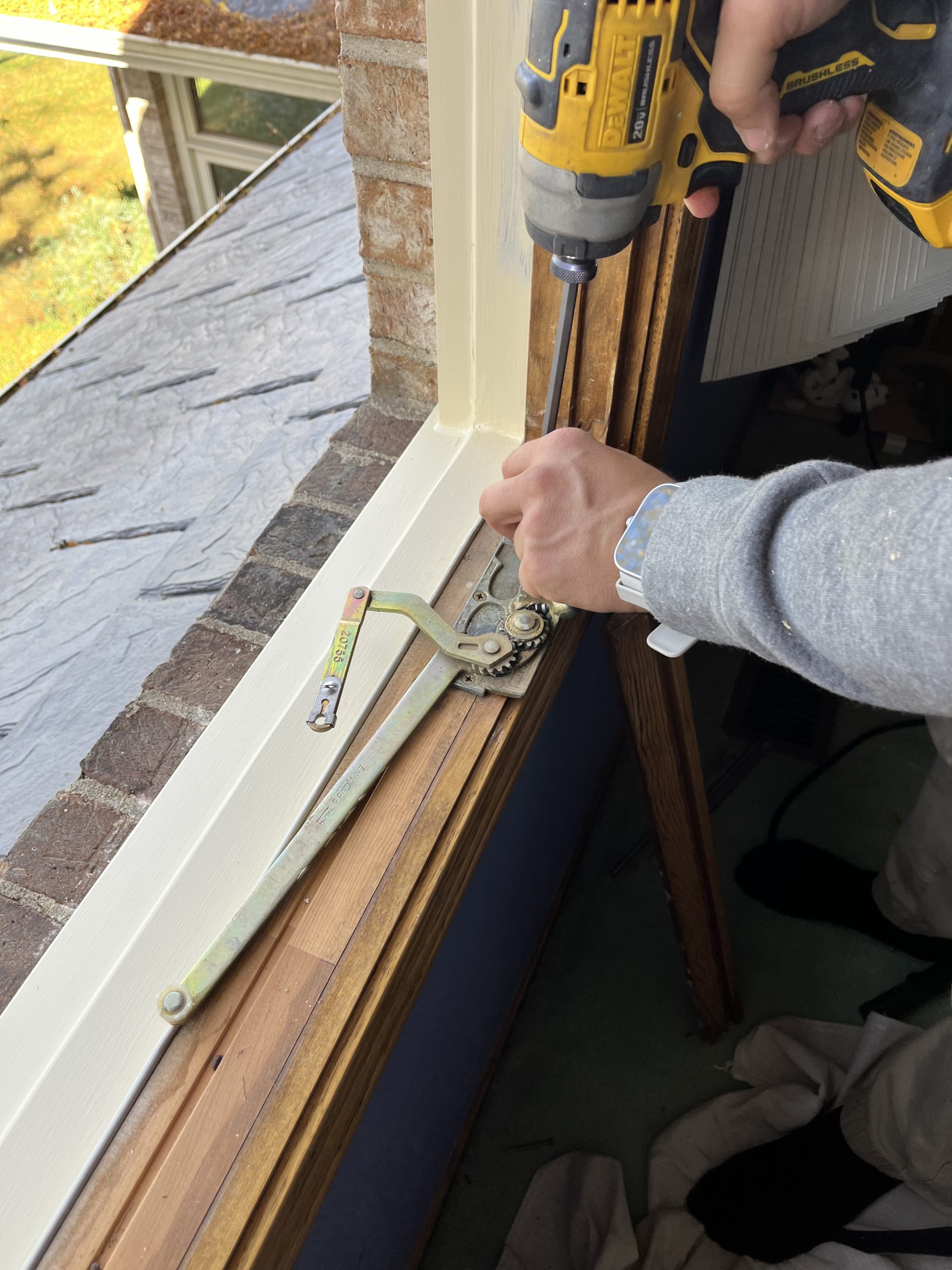 Arax Window Specialists repairing window hardware in a Mount Prospect, IL home