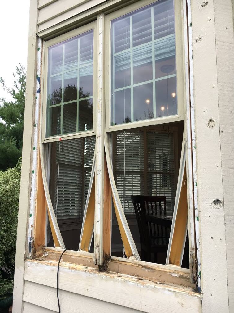 Wood window sill removed for repair, exterior view