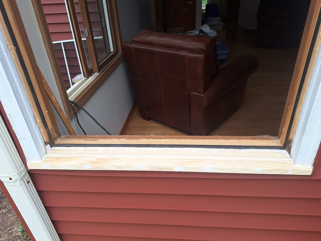 Arax Window Repair Technicians fixing window in a residential home